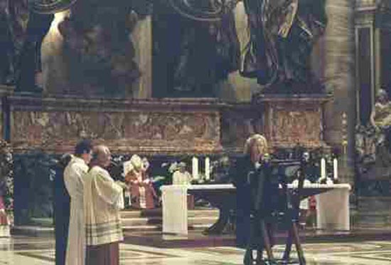 A woman reading the gospel before the altar